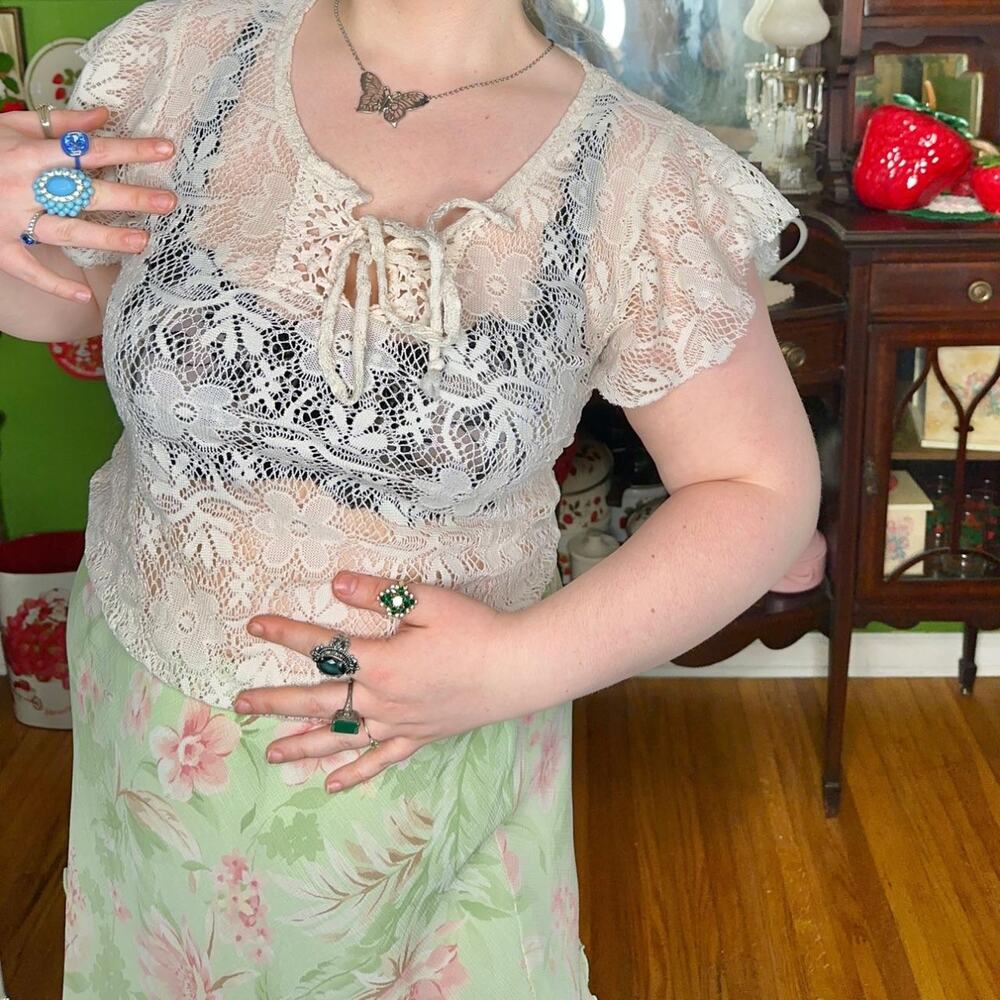 Vintage y2k sheer lace blouse, features ruffle sleeves and a lace up neckline!
